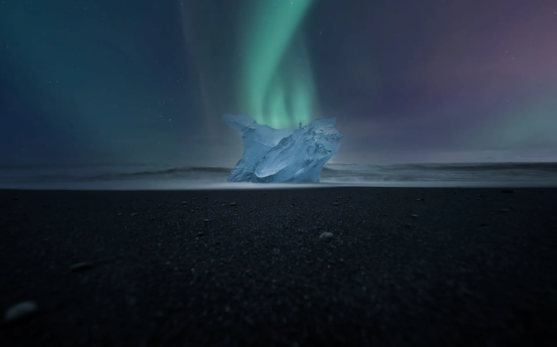 Iceberg fragments on the black volcanic sand of Diamond Beach