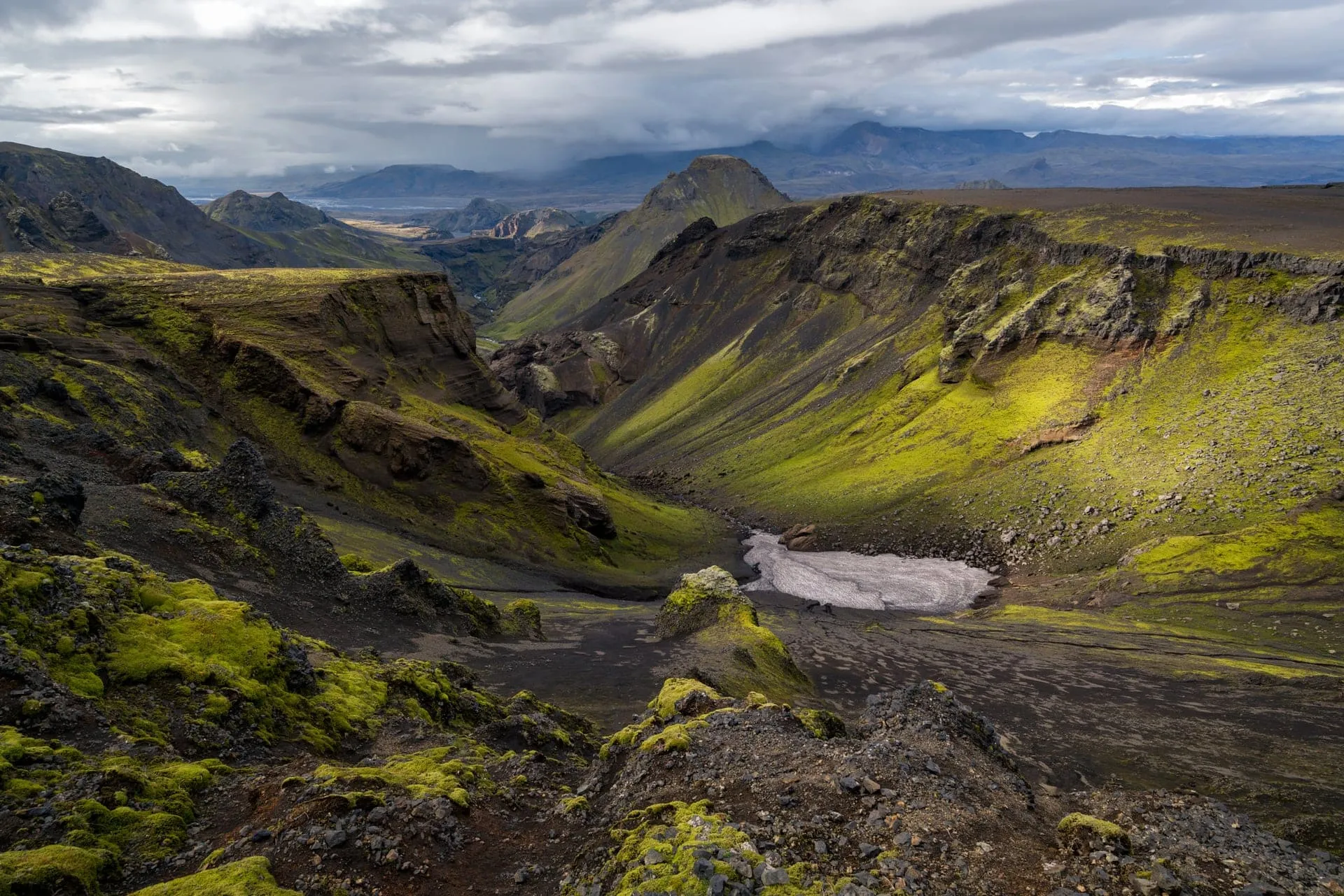The lush green Þórsmörk valley between glaciers in the South Iceland Highlands on a late-August afternoon